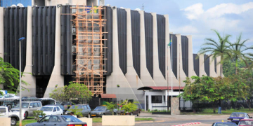 Libreville, Gabon: Primature building, the headquarters of the Government of Gabon - Office of the Prime Minister and the Cabinet - In the political system of the Republic of Gabon, the Gabonese president is head of state and de facto head of government . He appoints the Prime Minister and his cabinet. The government is divided into three branches: the executive, headed by the prime minister, the legislative, made up of the two houses of parliament, and the judiciary - 'Primature de la République Gabonaise',  John Paul II Avenue - aka December 2nd building.