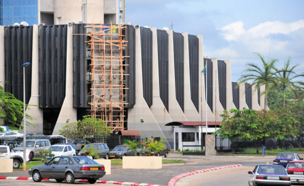 Libreville, Gabon: Primature building, the headquarters of the Government of Gabon - Office of the Prime Minister and the Cabinet - In the political system of the Republic of Gabon, the Gabonese president is head of state and de facto head of government . He appoints the Prime Minister and his cabinet. The government is divided into three branches: the executive, headed by the prime minister, the legislative, made up of the two houses of parliament, and the judiciary - 'Primature de la République Gabonaise',  John Paul II Avenue - aka December 2nd building.