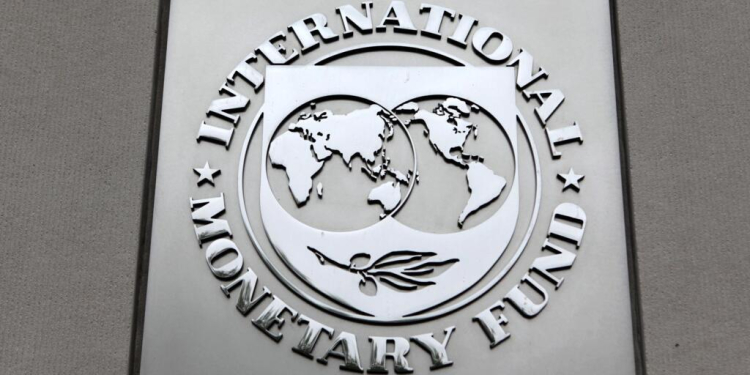The International Monetary Fund (IMF) logo is seen at the IMF headquarters building in Washington, in this April 18, 2013 file photo. The IMF is expected to issue its semi-annual world economic outlook this week. REUTERS/Yuri Gripas/Files GLOBAL BUSINESS WEEK AHEAD PACKAGE - SEARCH "BUSINESS WEEK AHEAD JANUARY 18" FOR ALL IMAGES